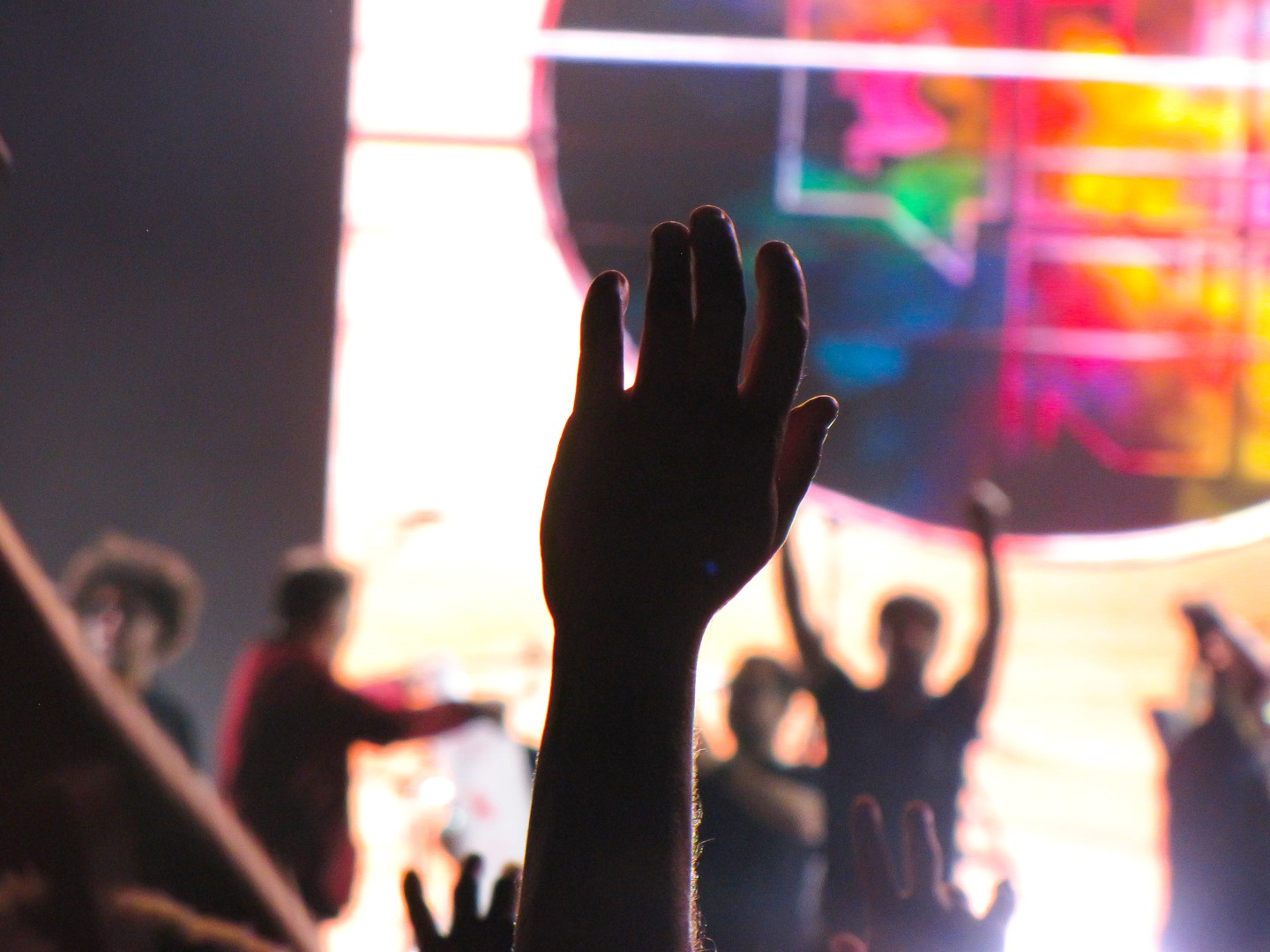 Some hands cheering on a show.